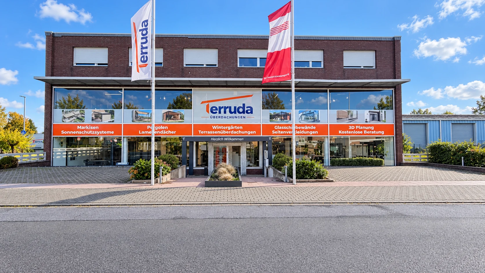 Terruda-Showroom in Rheinberg mit Glasfront und Fahnen
